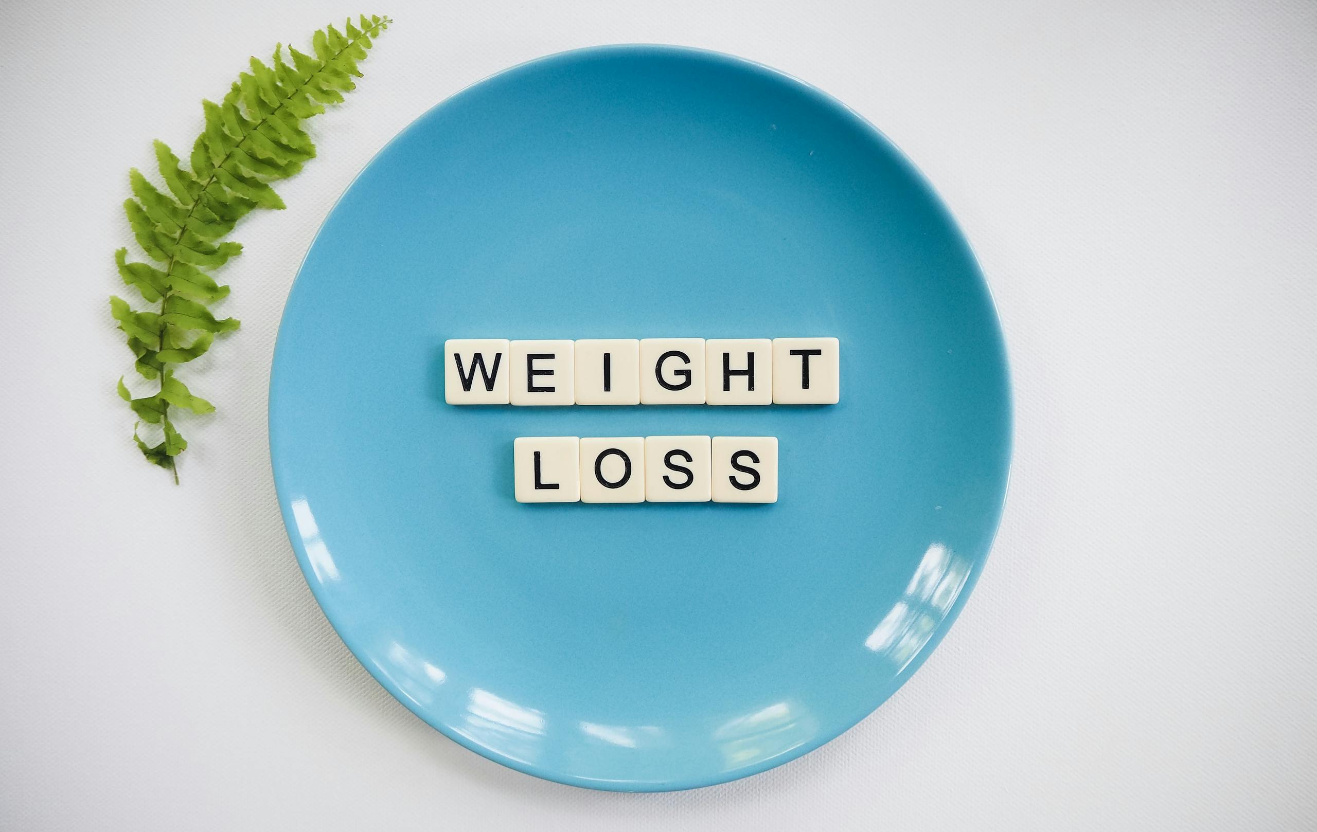 a blue plate with letters on it highlighting Black Friday weight loss deals Arizona